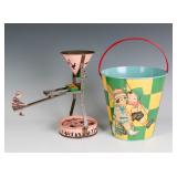 A TIN LITHO SEE-SAW SAND TOY AND NICE CHILD