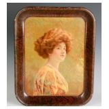 A 1911 AMERICAN ART WORKS TIN LITHO TRAY, JEANETTE
