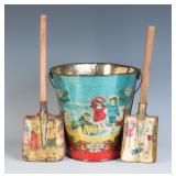 A 19TH CENTURY VICTORIAN SAND PAIL AND TWO SHOVELS
