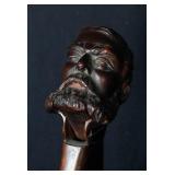 A BLACK FOREST CARVED NUT CRACKER - ONE-EYED MAN