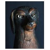 A BLACK FOREST GLASS EYED DOG WOOD NUT CRACKER