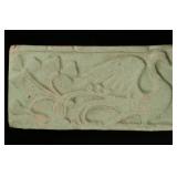 A GOOD CARVED TERRA COTTA TILE, MATTE GREEN GLAZE