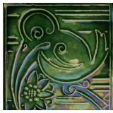 AN EARLY 20TH CENTURY PIPING DECORATED ART TILE