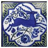 A CIRCA 1900 GLAZED TERRA COTTA TILE
