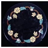 A CIRCULAR ART POTTERY TILE