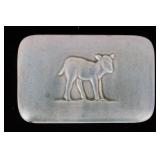 AN ART POTTERY PAPERWEIGHT FOR W. T. LAMP & SONS