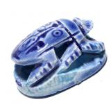A GLAZED POTTERY SCARAB