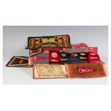 A COLLECTION OF TOBACCO SILKS AND FLANNELS