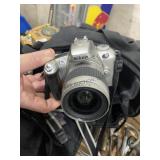 Nikon and Canon Cameras w/ Extra Lenses & Canon Ba