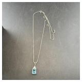Sterling silver blue topaz necklace. Measures appr