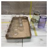 Lot of glassware. Drinking glasses, water pitcher,