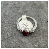 Sterling silver garnet ring. Marked .925. Size 6 1