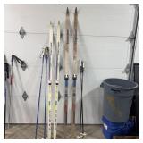 Two Pairs Of Snow Skis And Two Sets Of Ski Poles.