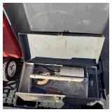 Metal toolbox with assorted tools including