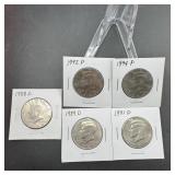 Five 1990s Kennedy Half Dollars