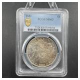 1881 toned Morgan silver dollar, graded MS-63.