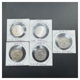 Five Susan B. Anthony dollars.