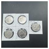 Bag containing five Kennedy half dollars from the.