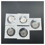 Five Bicentennial Washington quarters.