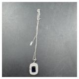 Necklace featuring blue topaz and genuine diamonds