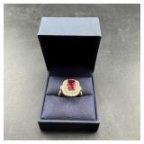 Gold ring set with ruby and genuine diamonds.