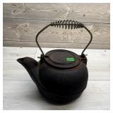 Cast iron water kettle.