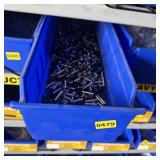 Bolt bin containing assorted hardware and bolts/Mi