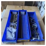 Three blue storage bins containing miscellaneous b