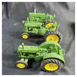Three Small John Deere Tractors