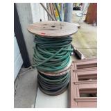 Large Wooden Spool With Mixed Garden Hoses