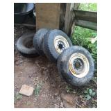 Four LT225/75R16 Radial Tires with Steel Wheels