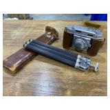 Camera with leather case and tripod