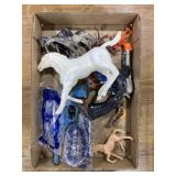 Cowboy toys: horses, toy guns, and a couple
