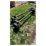 3-Brand new Axles and 2-tires for smaller axle
