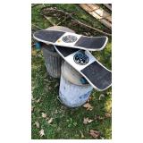 2-metal trash cans and 2-roller blades