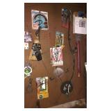 All items hanging on the back peg board (J-B