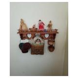 Shelf and contents, plates on wall