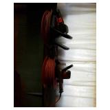 2 electric hedge trimmers and extension cords