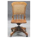 Rolling Wood Cane Back Chair