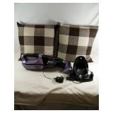 2 pillows With A Cordless Shark Vacuum Powers On