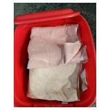 Tote With Lid Full Of Unsearched Towels And Dish
