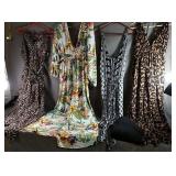 Three Jump Suits , A Long Dress And A Sweater