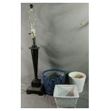 Three Various Sizes Of Flower Pots And A Wooden