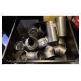 Metal bin filled with chimney attachments - all