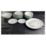 Mixed set of Corelle-style dinnerware including