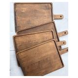 Set of four matching wooden serving boards with