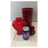 Collection of three red glass vases including a
