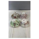 Set of four vintage teacup and saucer pairs in