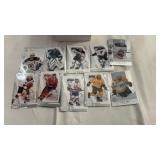 Group of mixed sports trading card packs and sets