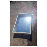 Rectangular framed mirror featuring a